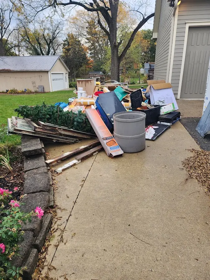 Dumpster being loaded with debris for Commercial Dumpster Rental in Chatsworth